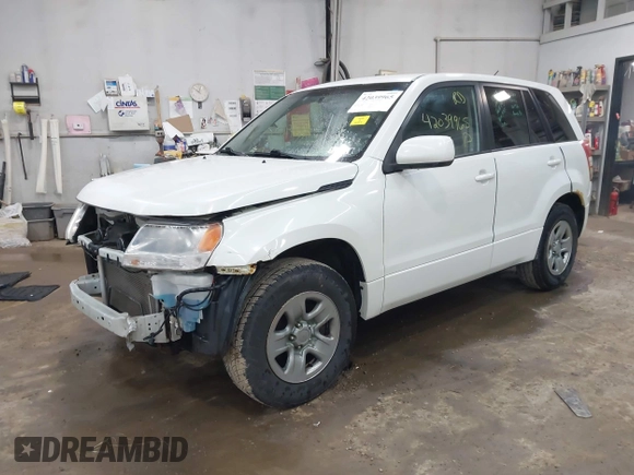2012 Suzuki Grand Vitara Premium with VIN JS3TD0D26C4100406, listed as a IAAI auction lot 42039965 with 106,671 mi miles and . Bid and sale history available at DreamBid. Image 2.