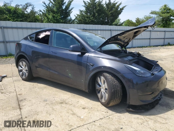 2024 Tesla Model Y with VIN 7SAYGDED6RF091715, listed as a Copart auction lot 56535585 with 23,120 mi miles and Salvage title. Bid and sale history available at DreamBid. Image 4.