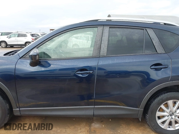 2015 Mazda CX-5 Touring with VIN JM3KE2CY5F0449195, listed as a IAAI auction lot 41894567 with 124,694 mi miles and . Bid and sale history available at DreamBid. Image 14.