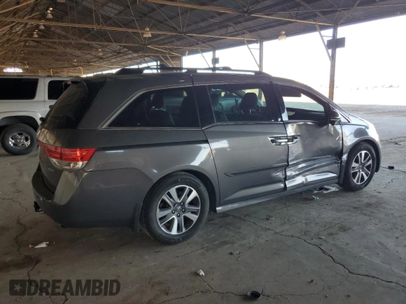2014 Honda Odyssey Touring with VIN 5FNRL5H99EB111525, listed as a Copart auction lot 61986005 with 137,905 mi miles and Salvage title. Bid and sale history available at DreamBid. Image 3.