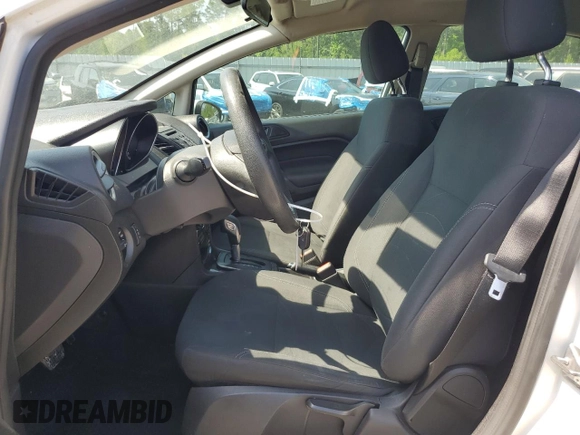 2019 Ford Fiesta SE z VIN 3FADP4BJ2KM147288, wystawiony jako Copart lot #55391125 z przebiegiem 83 887 mil mil oraz Szkoda całkowita • Salvage title. Historia ofert i sprzedaży dostępna na DreamBid. Obrazek 7.