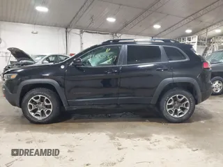 2022 Jeep Cherokee Trailhawk with VIN 1C4PJMBX8ND517236, listed as a IAAI auction lot 41530369 with 34,164 mi miles and . Bid and sale history available at DreamBid. Image 14.