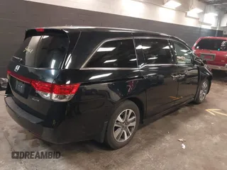 2014 Honda Odyssey Touring with VIN 5FNRL5H94EB105745, listed as a IAAI auction lot 41744012 with 77,032 mi miles and . Bid and sale history available at DreamBid. Image 4.
