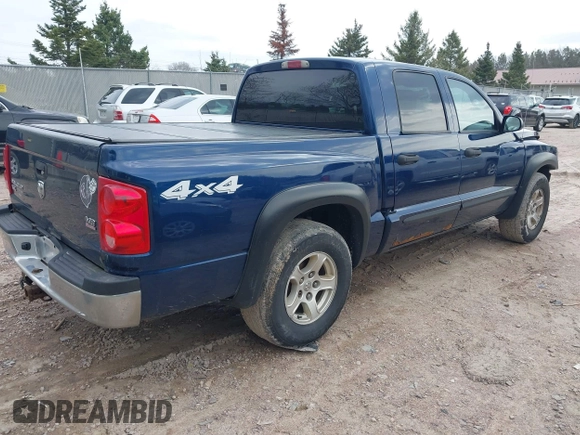2005 Dodge Dakota SLT with VIN 1D7HW48N65S288584, listed as a IAAI auction lot 42130695 with 221,636 mi miles. Bid and sale history available at carsss.com. Image 4.