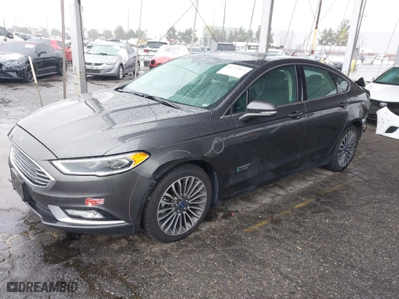 2017 Ford Fusion Energi Titanium with VIN 3FA6P0SU8HR329570, listed as a IAAI auction lot 41773023 with 112,022 mi miles. Bid and sale history available at carsss.com. Image 18.