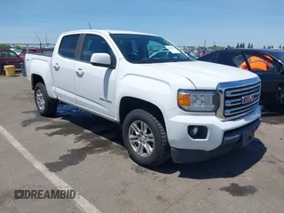 2019 GMC Canyon 4WD SLE z VIN 1GTG6CEN9K1301897, wystawiony jako IAAI lot #42281370 z przebiegiem 91 405 mil mil oraz . Historia ofert i sprzedaży dostępna na DreamBid. Obrazek 1.