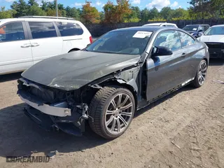 2015 BMW M4 with VIN WBS3R9C51FK333490, listed as a IAAI auction lot 40217693 with NaN miles. Bid and sale history available at carsss.com. Image 20.
