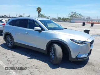 2020 Mazda CX-9 Touring with VIN JM3TCACY0L0424155, listed as a IAAI auction lot 42688501 with 60,142 mi miles and . Bid and sale history available at DreamBid. Image 1.