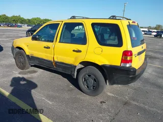 2002 Ford Escape XLS Choice with VIN 1FMYU01132KD56671, listed as a IAAI auction lot 41552541 with 245,923 mi miles and . Bid and sale history available at DreamBid. Image 3.