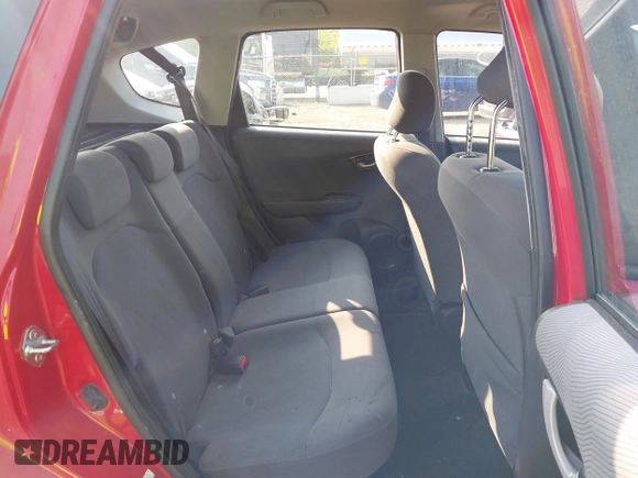 2009 Honda Fit z VIN JHMGE88219S023503, wystawiony jako IAAI lot #42376165 z przebiegiem 142 166 mil mil oraz . Historia ofert i sprzedaży dostępna na DreamBid. Obrazek 8.