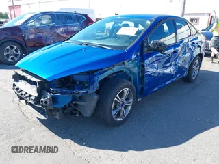 2018 Ford Focus SE z VIN 1FADP3FE4JL279265, wystawiony jako IAAI lot #42068130 z przebiegiem 43 616 mil mil oraz . Historia ofert i sprzedaży dostępna na DreamBid. Obrazek 2.