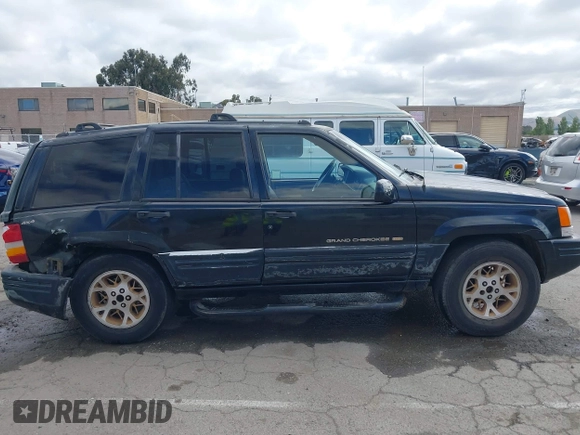 1996 Jeep Grand Cherokee Limited z VIN 1J4GZ78Y3TC191000, wystawiony jako IAAI lot #42259621 z przebiegiem 212 690 mil mil oraz . Historia ofert i sprzedaży dostępna na DreamBid. Obrazek 13.