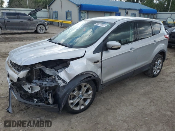 2013 Ford Escape SEL with VIN 1FMCU9HX1DUB15143, listed as a Copart auction lot 56237095 with 127,017 mi miles and Salvage title. Bid and sale history available at DreamBid. Image 1.