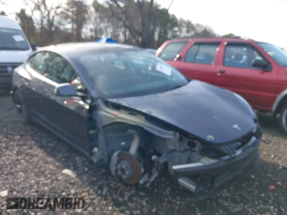 2023 Tesla Model 3 with VIN 5YJ3E1EAXPF666252, listed as a IAAI auction lot 42009929 with 27,328 mi miles and . Bid and sale history available at DreamBid. Image 6.