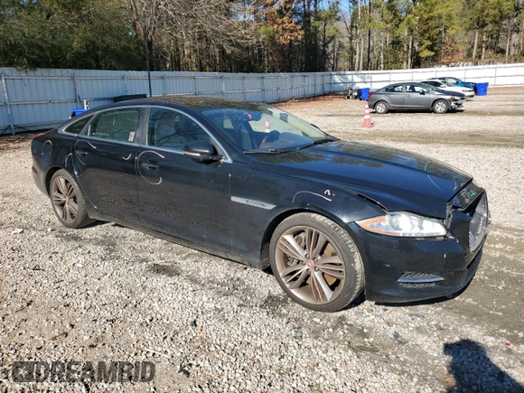 2015 Jaguar XJ with VIN SAJWA2GT8FMV83276, listed as a Copart auction lot 86521754 with 105,010 mi miles and Salvage Title. Bid and sale history available at DreamBid. Image 4.