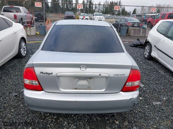 2003 Mazda Protege DX with VIN JM1BJ225330147296, listed as a IAAI auction lot 41484396 with 222,448 mi miles. Bid and sale history available at carsss.com. Image 16.