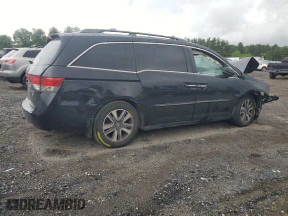 2014 Honda Odyssey Touring with VIN 5FNRL5H95EB056118, listed as a Copart auction lot 57729865 with Not provided miles and Salvage title. Bid and sale history available at DreamBid. Image 3.