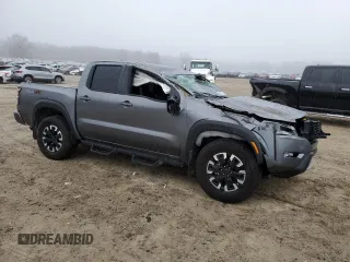 2024 Nissan Frontier Pro-4X with VIN 1N6ED1EK5RN627574, listed as a Copart auction lot 43977725 with 12,019 mi miles and Salvage title. Bid and sale history available at DreamBid. Image 4.