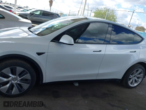 2024 Tesla Model Y Long Range with VIN 7SAYGDEE5RA222333, listed as a IAAI auction lot 41944404 with 12,176 mi miles. Bid and sale history available at carsss.com. Image 15.