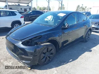2025 Tesla Model Y Long Range with VIN 7SAYGDEE9SF278607, listed as a IAAI auction lot 41932084 with 9,667 mi miles and . Bid and sale history available at carsss.com. Image 18.
