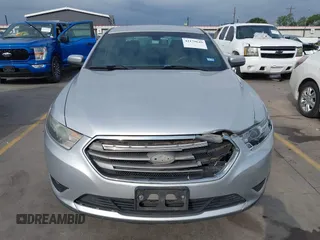 2015 Ford Taurus SEL z VIN 1FAHP2E88FG133328, wystawiony jako IAAI lot #42179649 z przebiegiem 127 171 mil mil oraz . Historia ofert i sprzedaży dostępna na DreamBid. Obrazek 12.