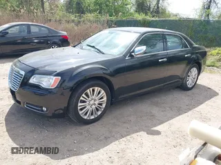 2013 Chrysler 300 with VIN 2C3CCAKG2DH645193, listed as a IAAI auction lot 42105459 with 230,063 mi miles. Bid and sale history available at carsss.com. Image 2.