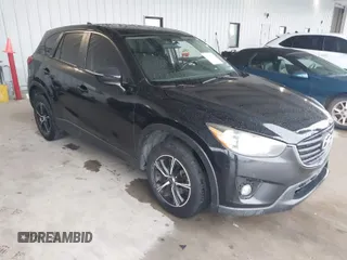 2016 Mazda CX-5 Touring with VIN JM3KE2CY2G0808424, listed as a IAAI auction lot 41880494 with 149,005 mi miles. Bid and sale history available at carsss.com. Image 1.