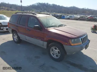 1999 Jeep Grand Cherokee Laredo with VIN 1J4GW58S6XC554582, listed as a IAAI auction lot 41780284 with 183,156 mi miles. Bid and sale history available at carsss.com. Image 1.