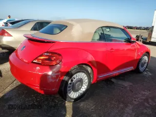 2014 Volkswagen Beetle 1.8T w/Premium z VIN 3VW517AT9EM819966, wystawiony jako Copart lot #76990014 z przebiegiem Nie podano mil oraz Nie do naprawy • Non repairable. Historia ofert i sprzedaży dostępna na DreamBid. Obrazek 3.
