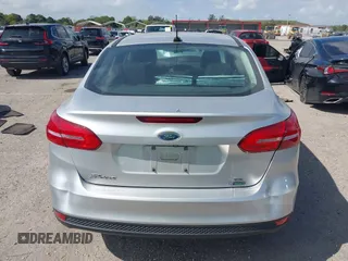 2018 Ford Focus SE z VIN 1FADP3FE3JL220529, wystawiony jako IAAI lot #41564216 z przebiegiem 16 883 mil mil oraz . Historia ofert i sprzedaży dostępna na DreamBid. Obrazek 16.