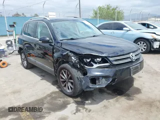 2017 Volkswagen Tiguan Wolfsburg Edition with VIN WVGRV7AX2HK005905, listed as a IAAI auction lot 42053590 with 94,864 mi miles and . Bid and sale history available at DreamBid. Image 1.