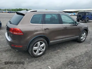 2013 Volkswagen Touareg Lux z VIN WVGEF9BP6DD010285, wystawiony jako Copart lot #54008285 z przebiegiem 172 257 mil mil oraz Czysty tytuł • Clean title. Historia ofert i sprzedaży dostępna na DreamBid. Obrazek 3.