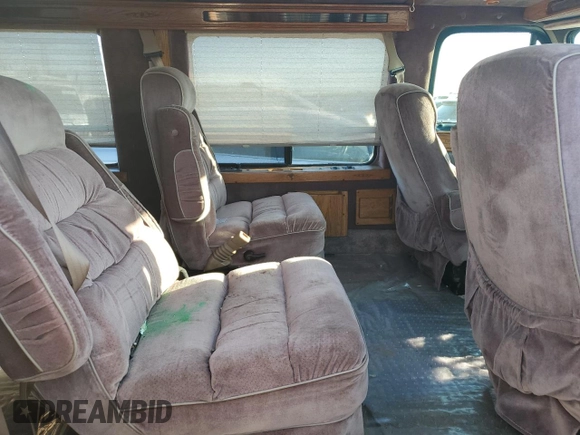 1995 GMC Vandura z VIN 1GDEG25K2SF543904, wystawiony jako Copart lot #68934904 z przebiegiem 949 271 mil mil oraz Szkoda całkowita • Salvage title. Historia ofert i sprzedaży dostępna na DreamBid. Obrazek 11.