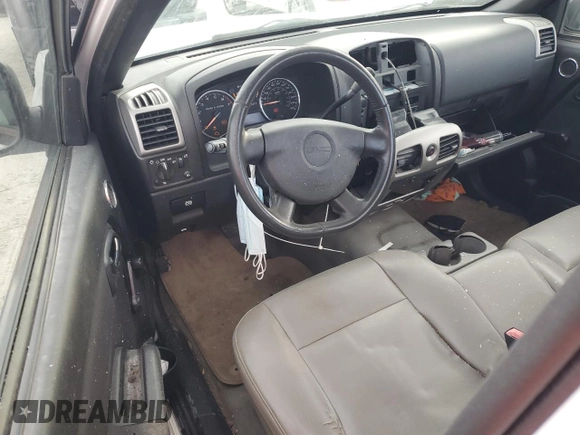 2010 GMC Canyon z VIN 1GTCSBD90A8149782, wystawiony jako Copart lot #74656504 z przebiegiem 242 911 mil mil oraz Szkoda całkowita • Salvage title. Historia ofert i sprzedaży dostępna na DreamBid. Obrazek 8.