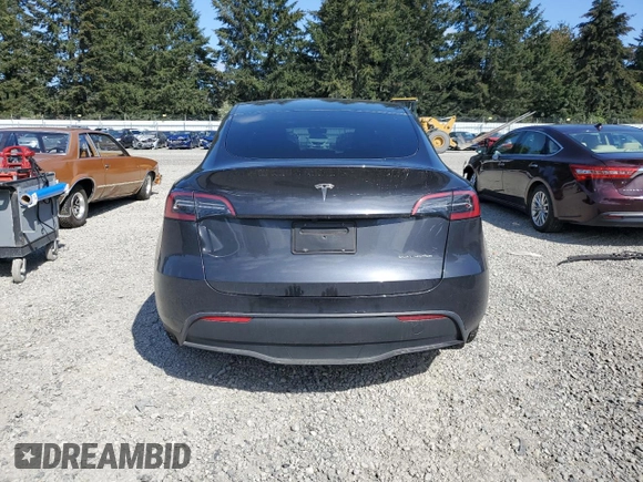 2024 Tesla Model Y Long Range with VIN 7SAYGAEE8RF987571, listed as a Copart auction lot 55110485 with 19,732 mi miles and Salvage title. Bid and sale history available at DreamBid. Image 6.