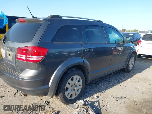 2017 Dodge Journey SE z VIN 3C4PDCAB9HT551840, wystawiony jako IAAI lot #41977338 z przebiegiem 202 856 mil mil oraz . Historia ofert i sprzedaży dostępna na DreamBid. Obrazek 4.