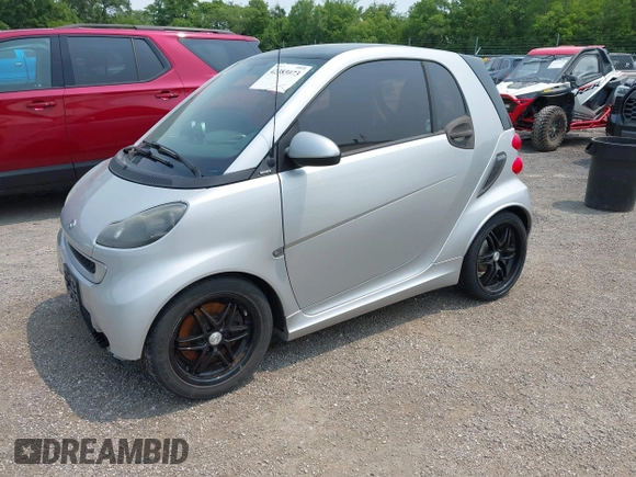 2009 Smart fortwo Pure with VIN WMEEJ31X39K276062, listed as a IAAI auction lot 42383073 with 108,190 mi miles and . Bid and sale history available at DreamBid. Image 2.