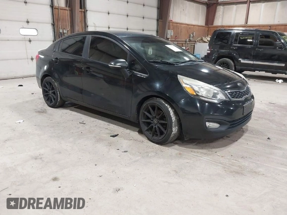 2013 Kia Rio SX with VIN KNADN4A38D6229948, listed as a IAAI auction lot 42007877 with 126,695 mi miles. Bid and sale history available at carsss.com. Image 1.
