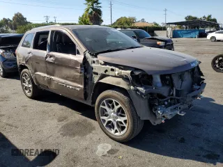2019 Jeep Grand Cherokee Overland with VIN 1C4RJFCT7KC833390, listed as a Copart auction lot 74015774 with 64,598 mi miles and Salvage Title. Bid and sale history available at carsss.com. Image 4.