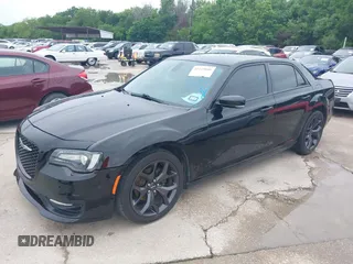2021 Chrysler 300 with VIN 2C3CCABG8MH524121, listed as a IAAI auction lot 42119886 with 84,593 mi miles. Bid and sale history available at carsss.com. Image 2.