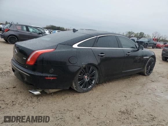 2014 Jaguar XJ Portfolio z VIN SAJWA2GZ2E8V64993, wystawiony jako Copart lot #88774965 z przebiegiem Nie podano mil oraz Szkoda całkowita • Salvage title. Historia ofert i sprzedaży dostępna na DreamBid. Obrazek 3.
