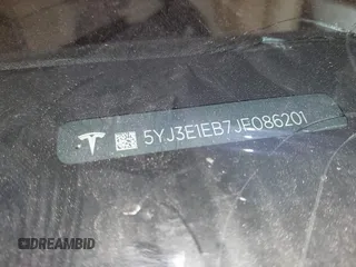 2018 Tesla Model 3 Long Range Battery with VIN 5YJ3E1EB7JF086201, listed as a IAAI auction lot 41965193 with 99,231 mi miles and . Bid and sale history available at DreamBid. Image 9.