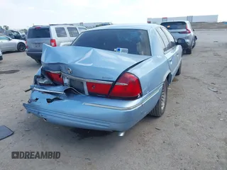 2000 Mercury Grand Marquis LS z VIN 2MEFM75W1YX673105, wystawiony jako IAAI lot #42050980 z przebiegiem 154 944 mil mil oraz . Historia ofert i sprzedaży dostępna na DreamBid. Obrazek 4.