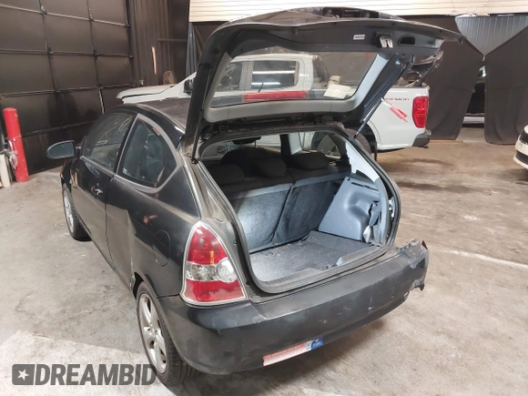 2007 Hyundai Accent SE with VIN KMHCN36C67U026540, listed as a IAAI auction lot 41062633 with 70,143 mi miles. Bid and sale history available at carsss.com. Image 3.