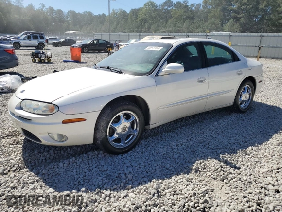 2003 Oldsmobile Aurora z VIN 1G3GS64CX34163493, wystawiony jako Copart lot #75863314 z przebiegiem 211 607 mil mil oraz Szkody całkowita. Historia ofert i sprzedaży dostępna na DreamBid. Obrazek 1.