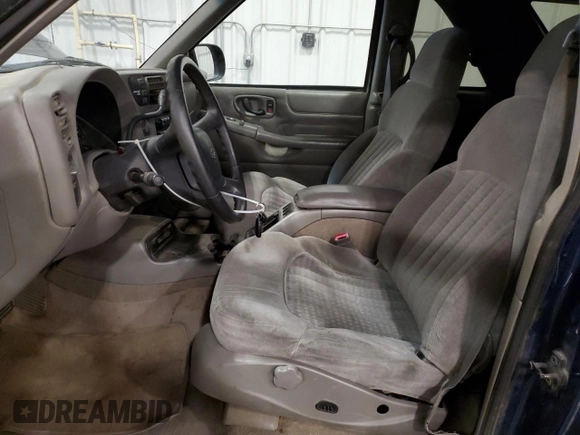 1999 Chevrolet Blazer LS с VIN 1GNCT18W9XK157387, выставлен на аукционе Copart как лот 49667765 с пробегом 182 411 миль миль и Списание • Salvage title. История ставок и продаж доступна на DreamBid. Изображение 7.