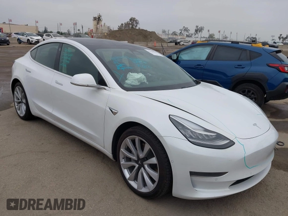 2020 Tesla Model 3 Standard Range Plus z VIN 5YJ3E1EAXLF806438, wystawiony jako IAAI lot #42104964 z przebiegiem 89 065 mil mil oraz . Historia ofert i sprzedaży dostępna na DreamBid. Obrazek 1.