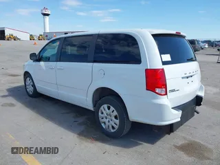 2014 Dodge Grand Caravan American Value with VIN 2C4RDGBG8ER140342, listed as a IAAI auction lot 42198306 with 135,564 mi miles and . Bid and sale history available at DreamBid. Image 3.