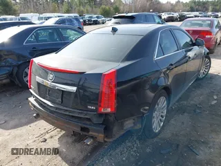 2012 Cadillac CTS with VIN 1G6DM5E39C0106931, listed as a IAAI auction lot 41909732 with 213,319 mi miles and . Bid and sale history available at DreamBid. Image 4.