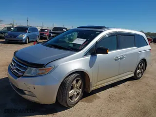 2013 Honda Odyssey Touring with VIN 5FNRL5H93DB076463, listed as a IAAI auction lot 41819994 with 188,911 mi miles. Bid and sale history available at carsss.com. Image 17.